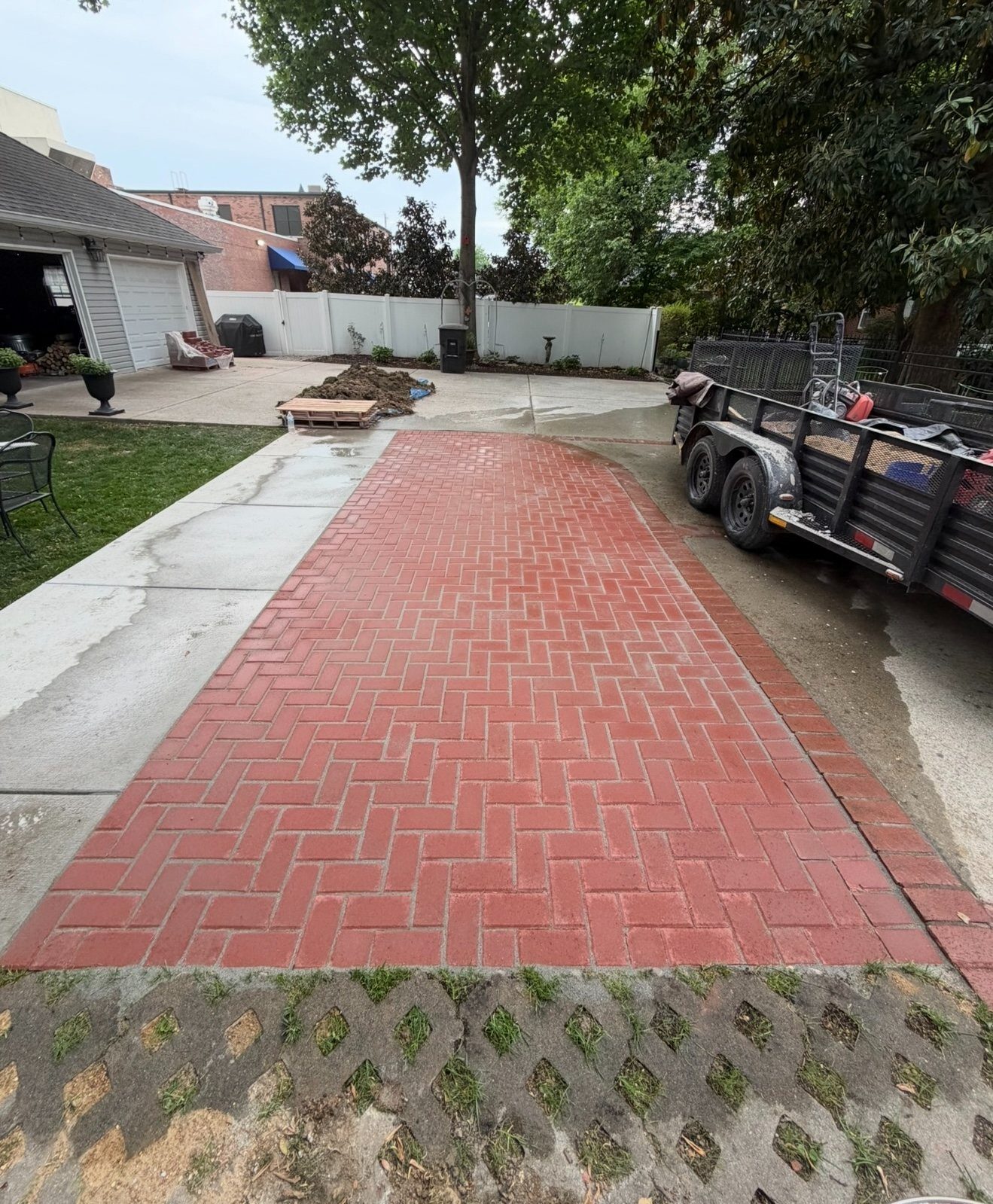 Red brick paver driveway with soldier-course border