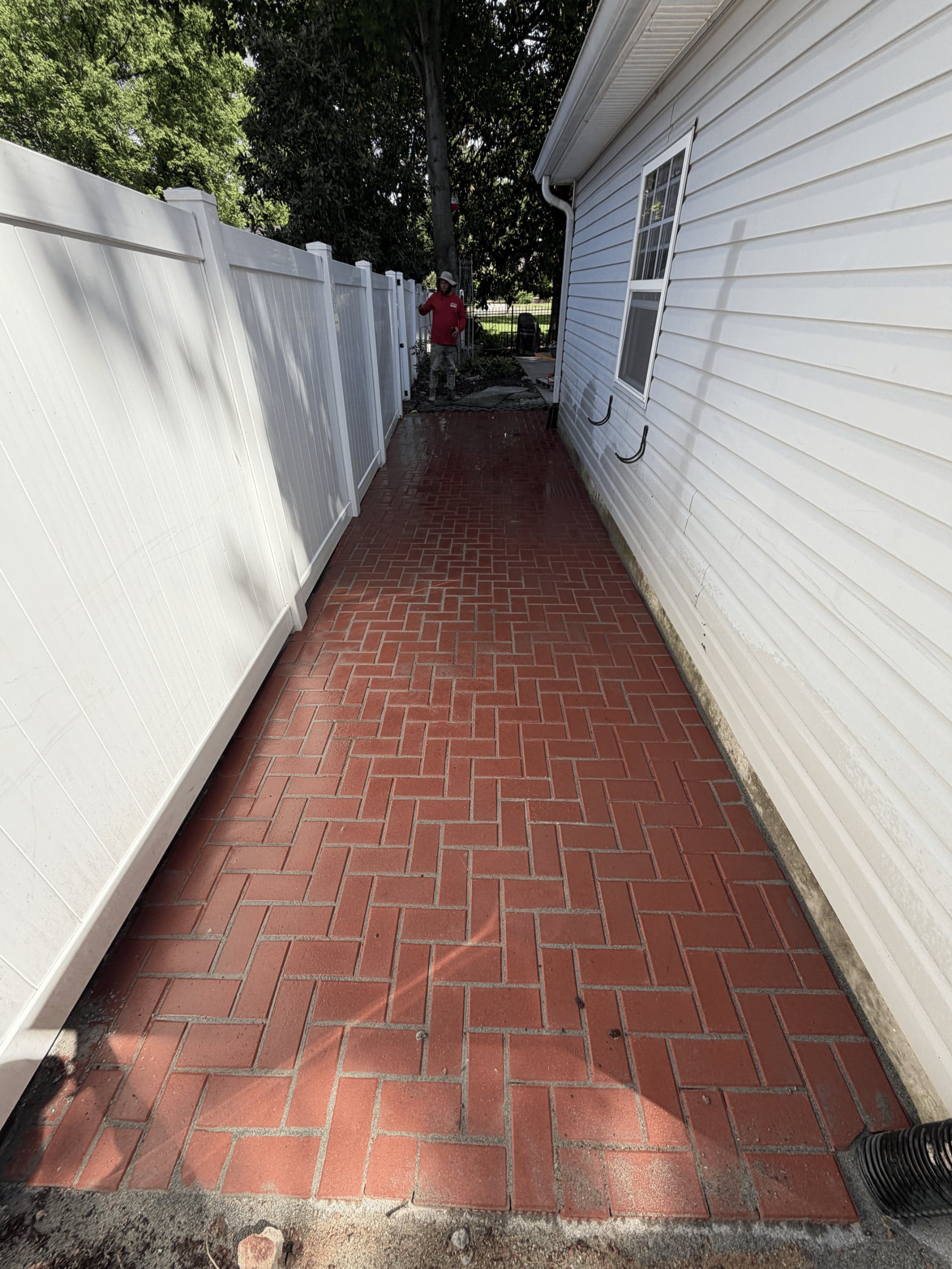 Completed brick side walkway with drainage routed away