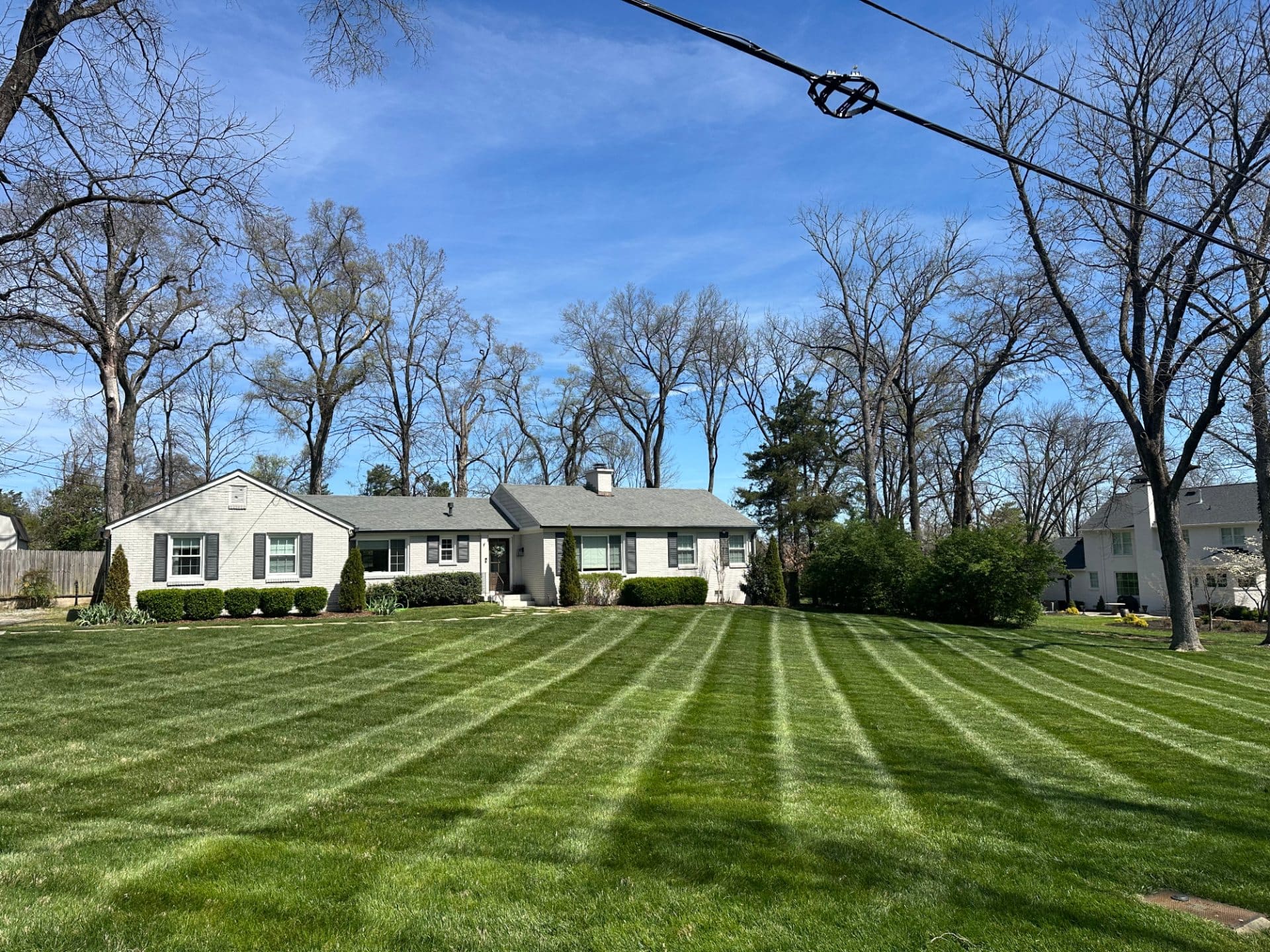 Crisp mow lines across a large front yard
