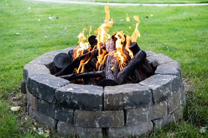 Stone fire pit with a fire burning