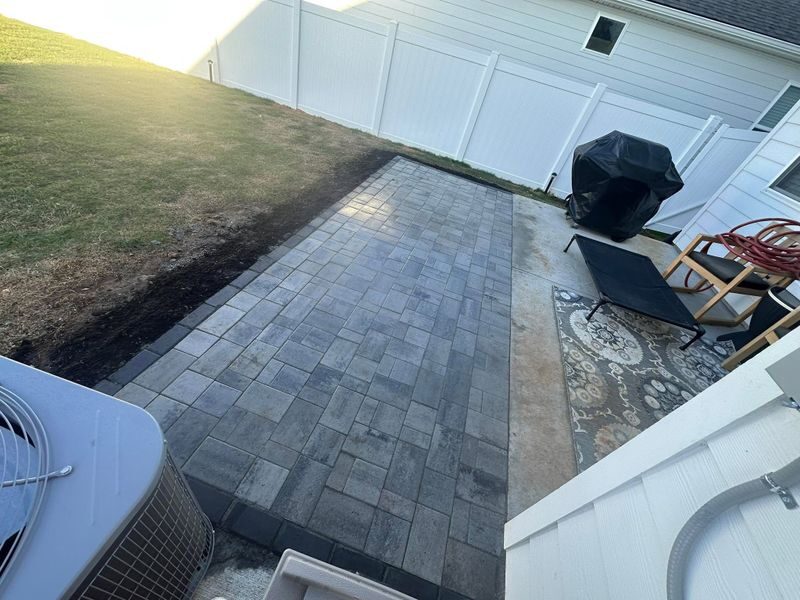 Finished paver patio with outdoor seating