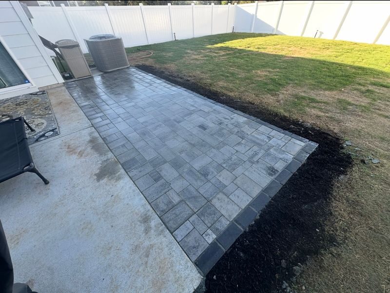 Freshly laid paver walkway with mulch border