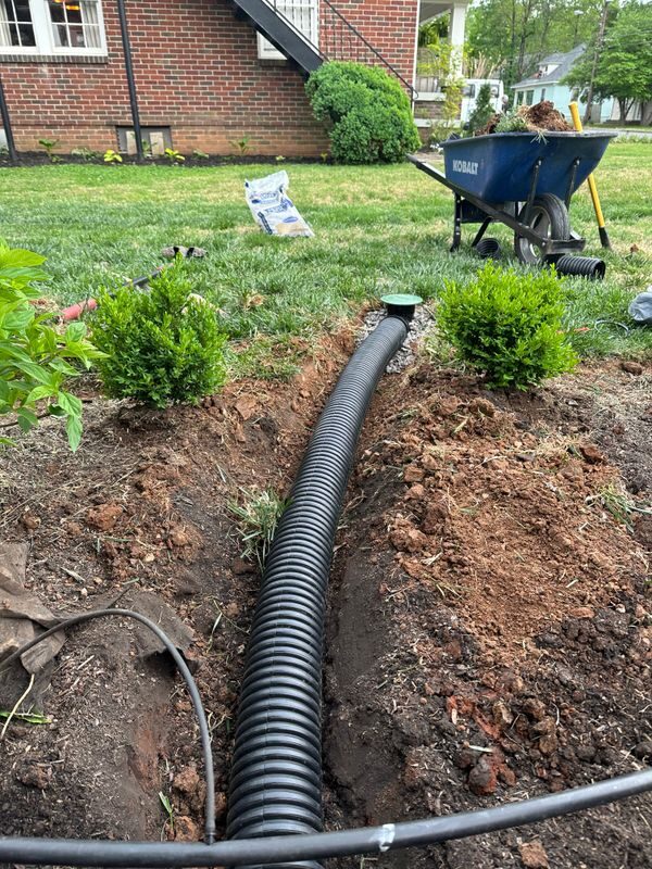 Corrugated drainage pipe laid in a trench