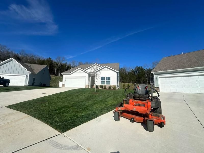 Zero-turn mower on a residential driveway